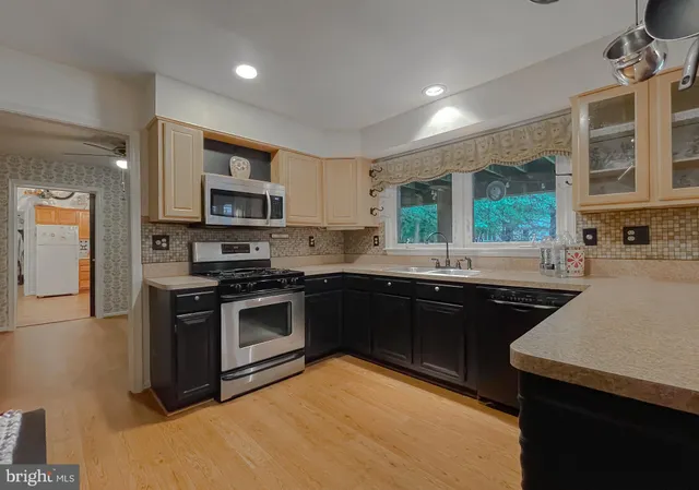 a view of a living room and kitchen view