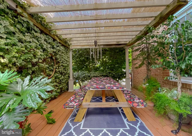 a front view of a house with yard and outdoor seating