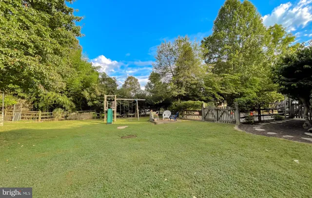 an aerial view of a house with a swimming pool yard and outdoor seating