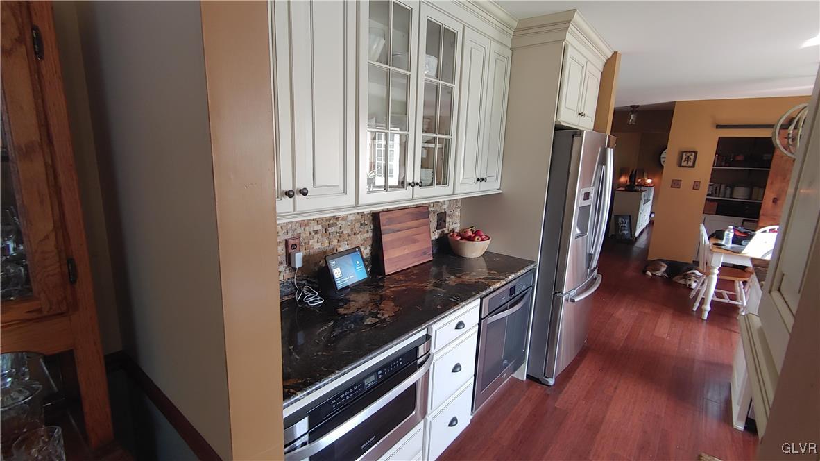4088 Old Sentry Road Allentown, PA 18104 - Photo 15 of 46 a kitchen with stainless steel appliances granite countertop a stove and a wooden floors