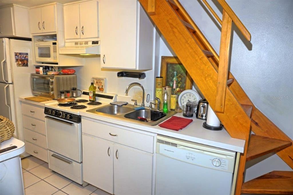 20857 Haulover Cove Road, Unit B14 Lutz, FL 33558 - Photo 14 of 35 a kitchen with appliances cabinets and a sink