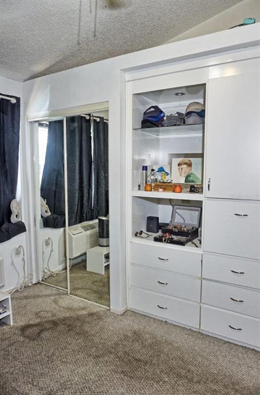 20857 Haulover Cove Road, Unit B14 Lutz, FL 33558 - Photo 19 of 35 a view of white cabinet