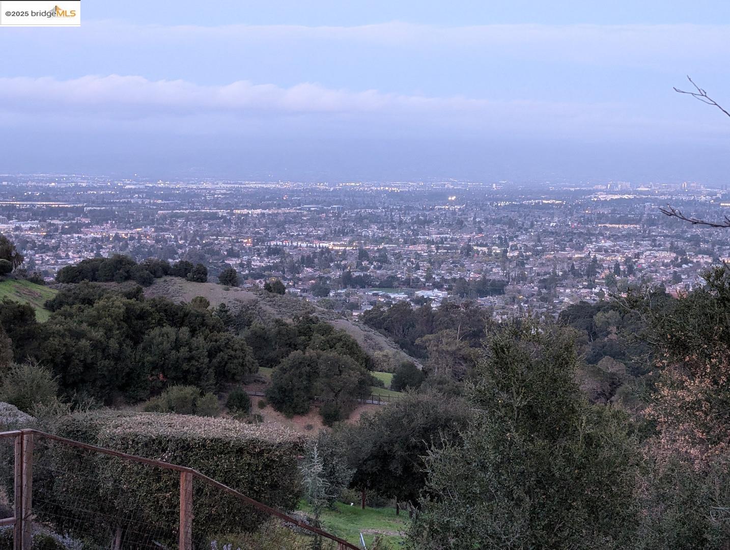 22346 Regnart Road Cupertino, CA 95014 - Photo 6 of 20 an aerial view of house with yard and mountain view in back