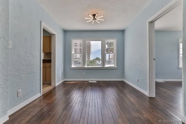 a kitchen with stainless steel appliances a refrigerator and a stove top oven