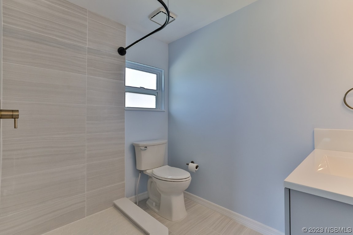 133 Milton Road Daytona Beach, FL 32118 - Photo 24 of 70 a bathroom with a toilet and a sink