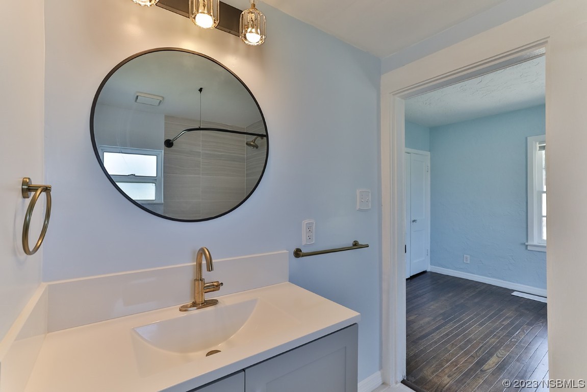 133 Milton Road Daytona Beach, FL 32118 - Photo 25 of 70 a bathroom with a sink and a mirror