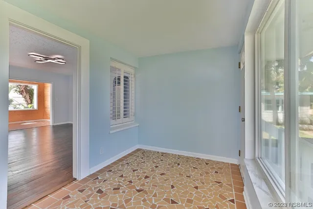 an empty room that has a window