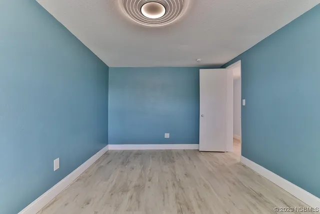 an aerial view of residential houses with yard and swimming pool