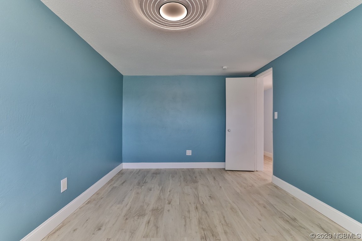 133 Milton Road Daytona Beach, FL 32118 - Photo 47 of 70 a view of a livingroom with wooden floor
