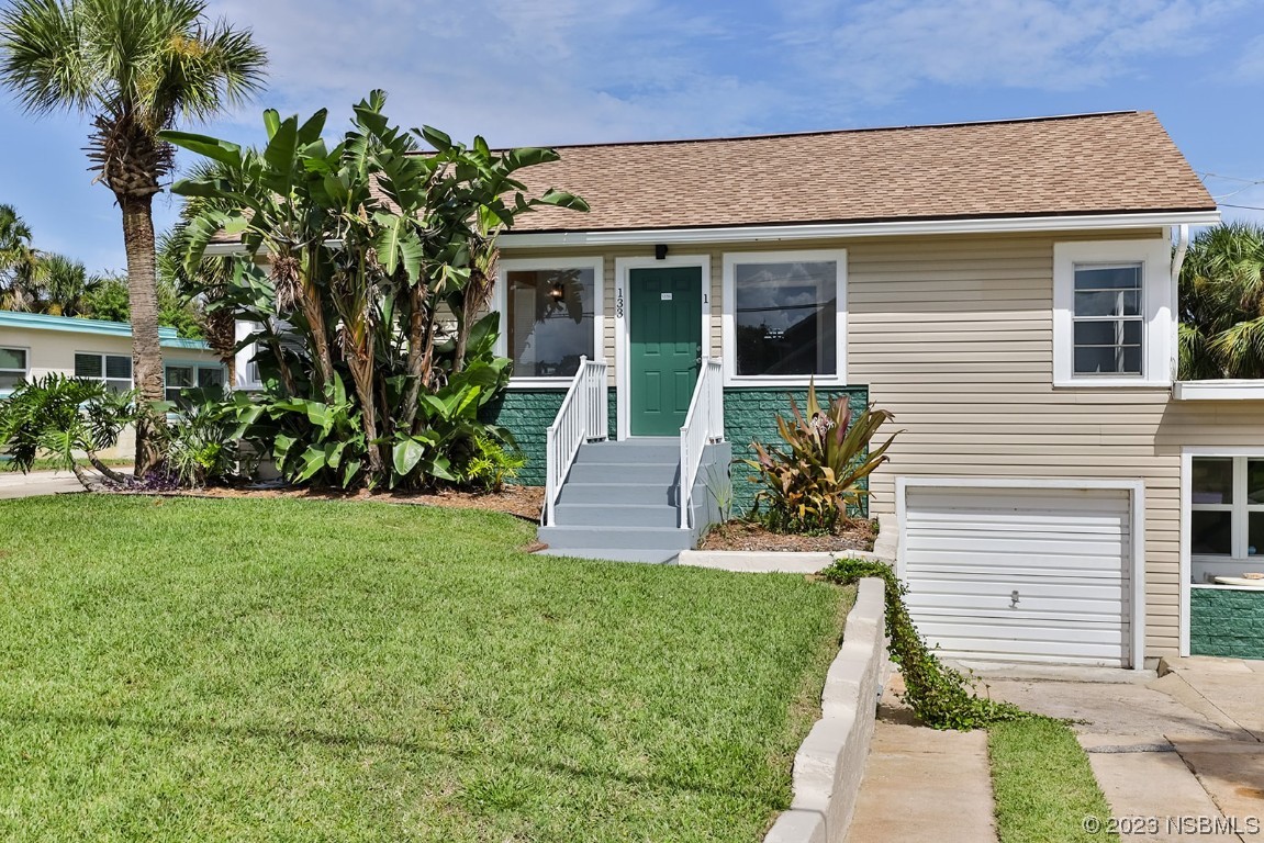 133 Milton Road Daytona Beach, FL 32118 - Photo 5 of 70 a front view of a house with garden and porch