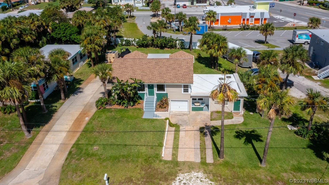 133 Milton Road Daytona Beach, FL 32118 - Photo 60 of 70 an aerial view of a house with swimming pool and outdoor seating