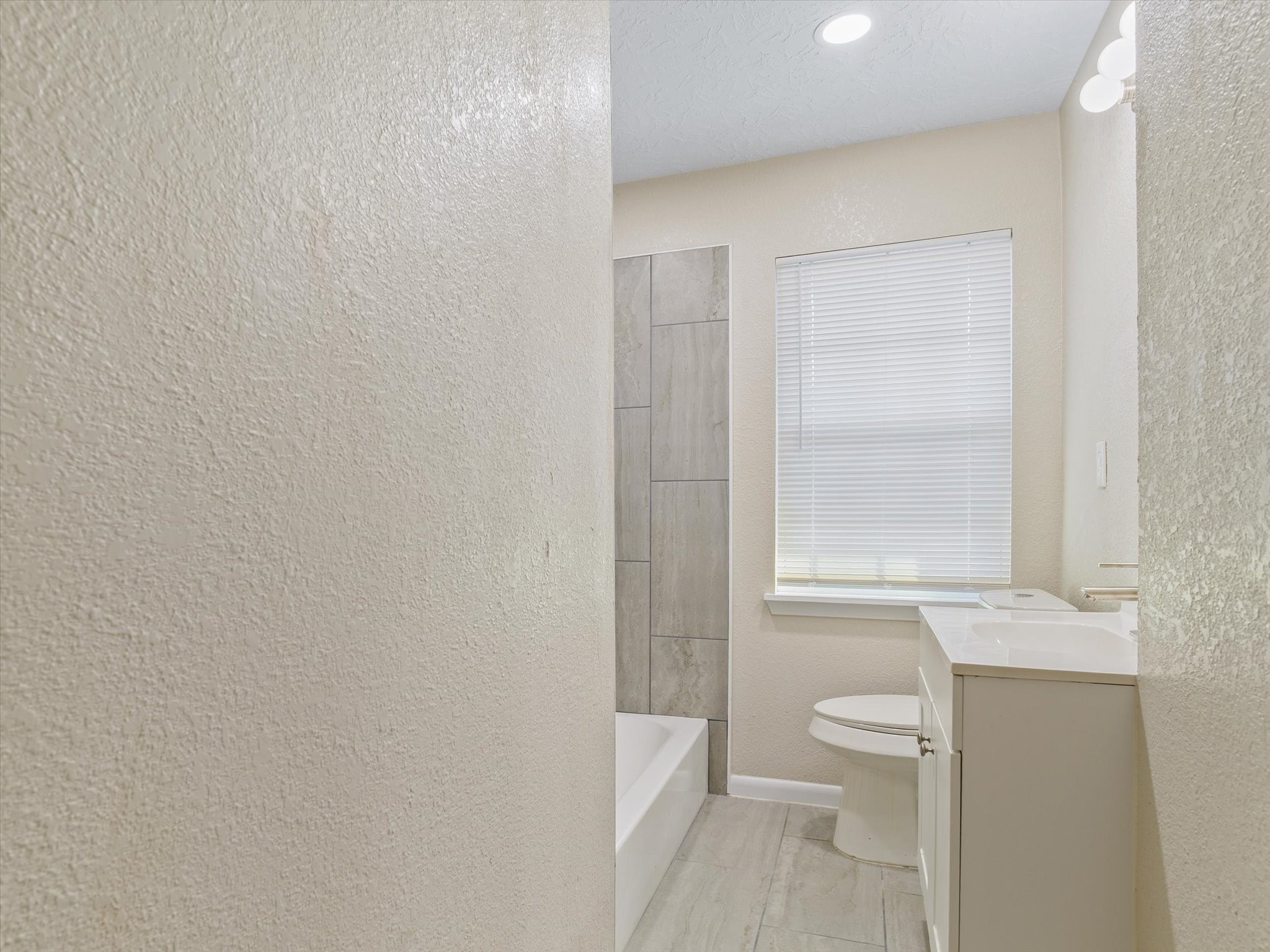3514 Mattye Maye Drive, Unit A Pasadena, TX 77503 - Photo 12 of 14 a bathroom with a toilet a sink a vanity and a window