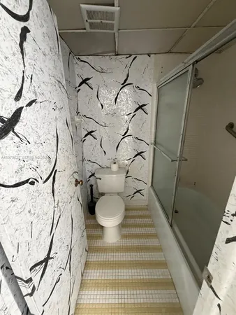 a bathroom with a bathtub and shower