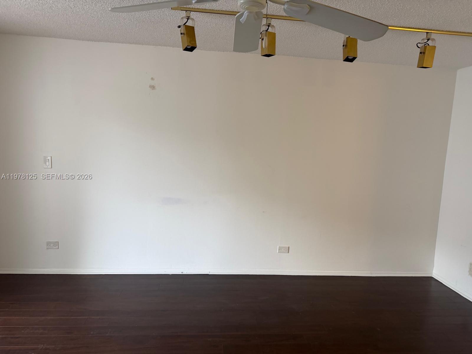 3720 Inverrary Drive, Unit 2K Lauderhill, FL 33319 - Photo 10 of 15 an empty room with wooden floor