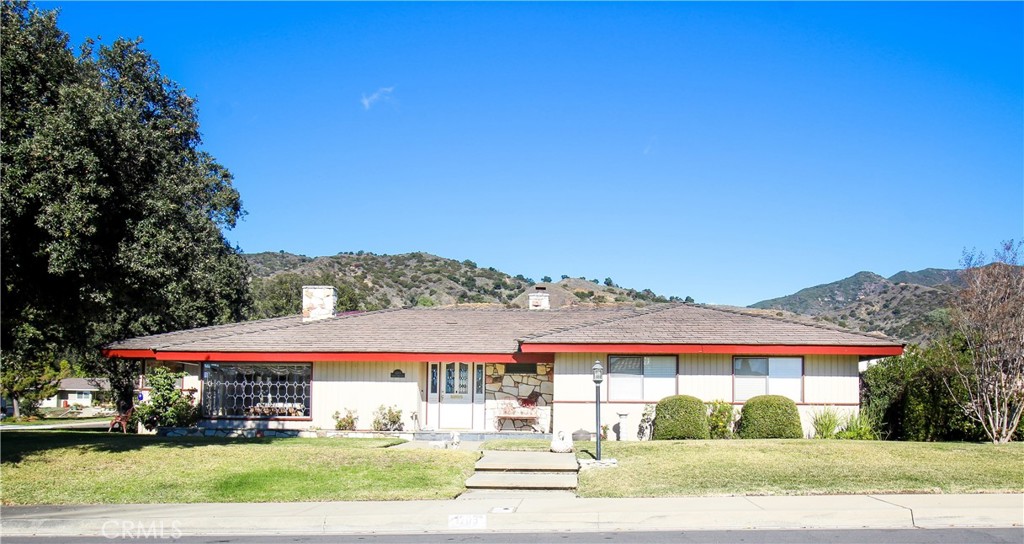1203 Hidden Springs Lane Glendora, CA 91741 - Photo 1 of 47 a front view of a house with a yard