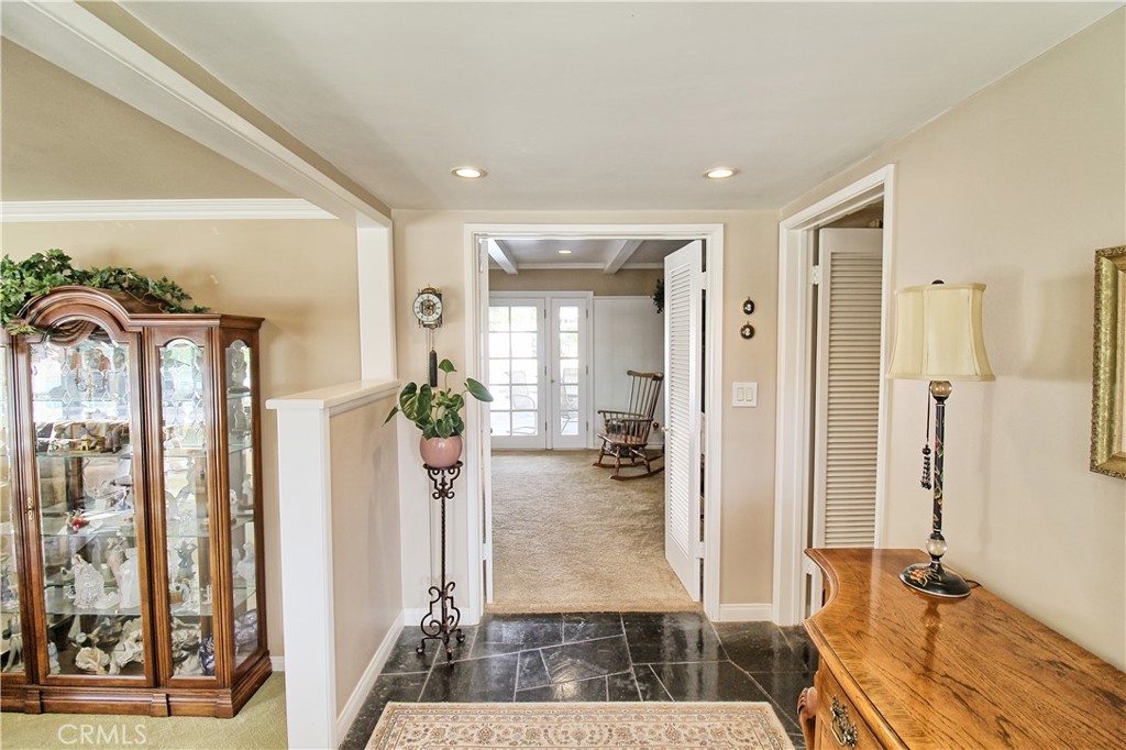 1203 Hidden Springs Lane Glendora, CA 91741 - Photo 11 of 47 a view of a hallway with bathroom and wooden floor