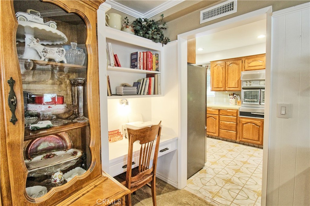 1203 Hidden Springs Lane Glendora, CA 91741 - Photo 18 of 47 a view of a workspace with furniture and a kitchen