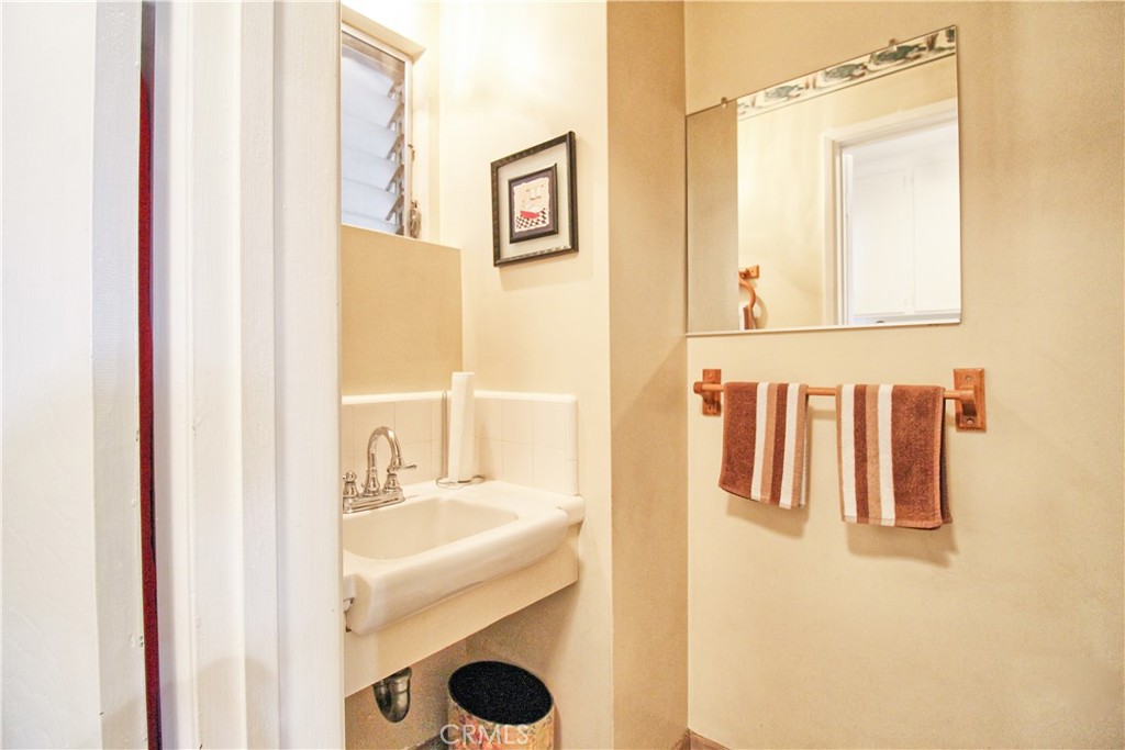 1203 Hidden Springs Lane Glendora, CA 91741 - Photo 22 of 47 a bathroom with a sink and a mirror