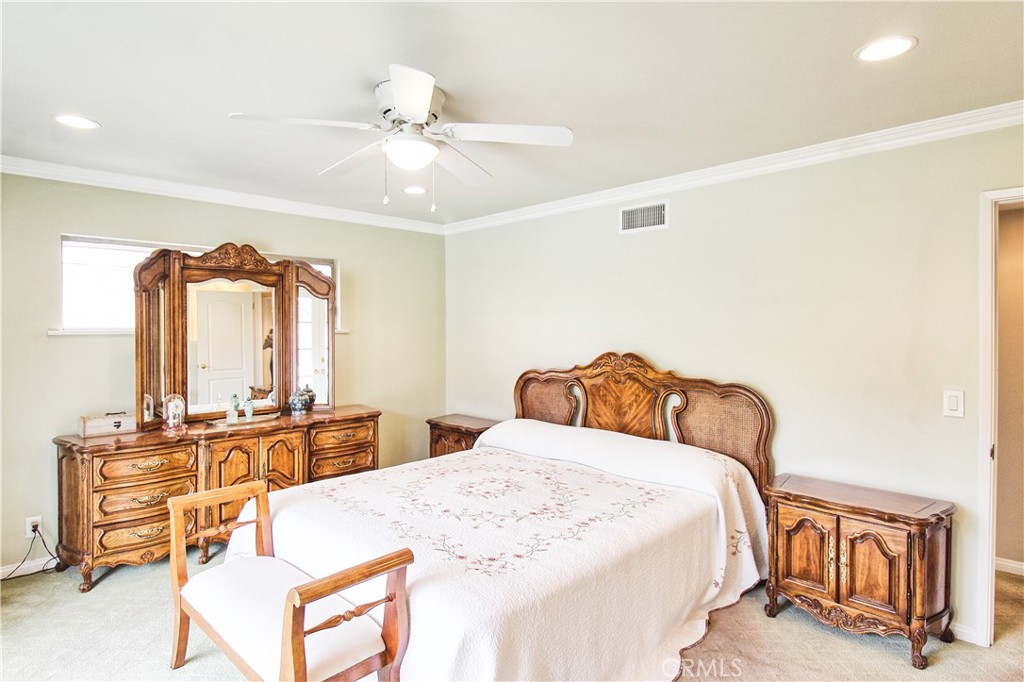 1203 Hidden Springs Lane Glendora, CA 91741 - Photo 26 of 47 a bedroom with a bed and dresser with mirror