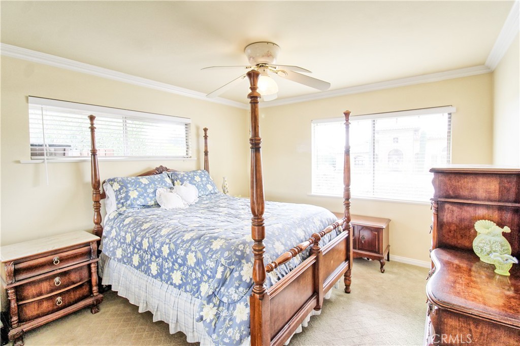 1203 Hidden Springs Lane Glendora, CA 91741 - Photo 34 of 47 a bedroom with a bed and a chandelier