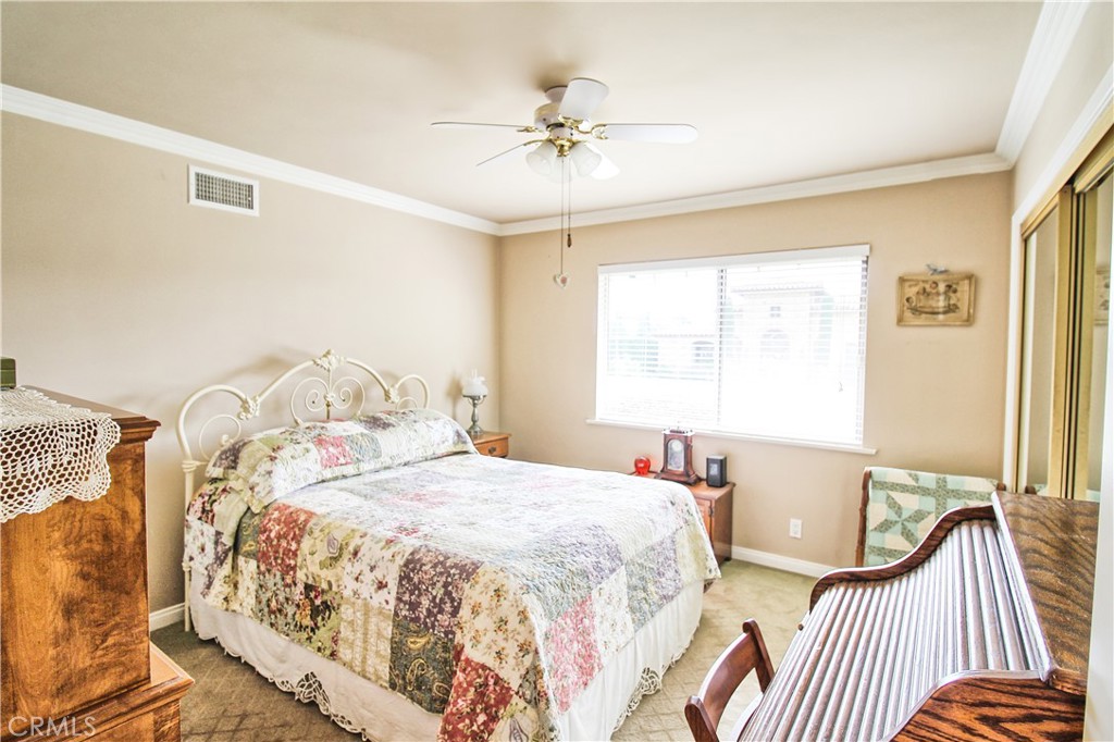 1203 Hidden Springs Lane Glendora, CA 91741 - Photo 36 of 47 a bedroom with a bed and a chandelier