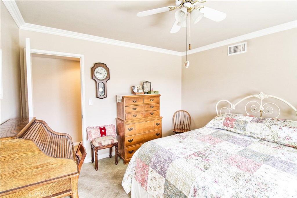 1203 Hidden Springs Lane Glendora, CA 91741 - Photo 37 of 47 a bedroom with a bed and a chandelier