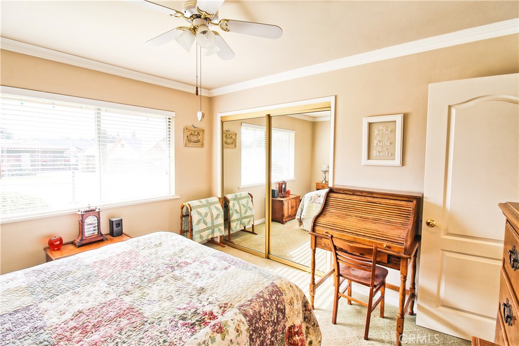 1203 Hidden Springs Lane Glendora, CA 91741 - Photo 38 of 47 a bedroom with a bed and a chandelier