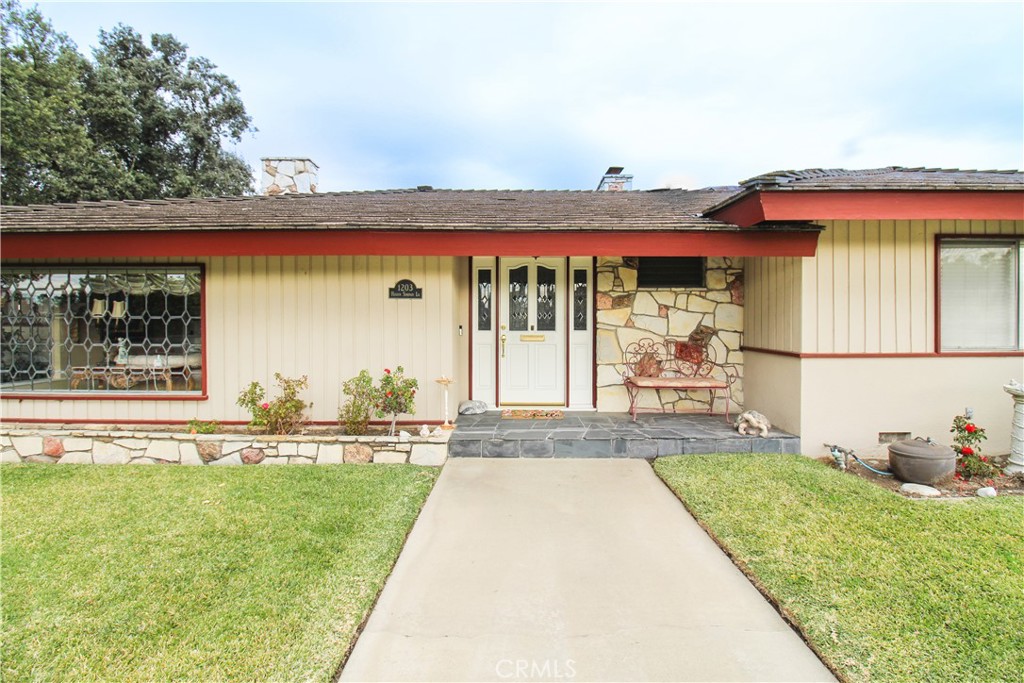 1203 Hidden Springs Lane Glendora, CA 91741 - Photo 8 of 47 a front view of a house with a yard