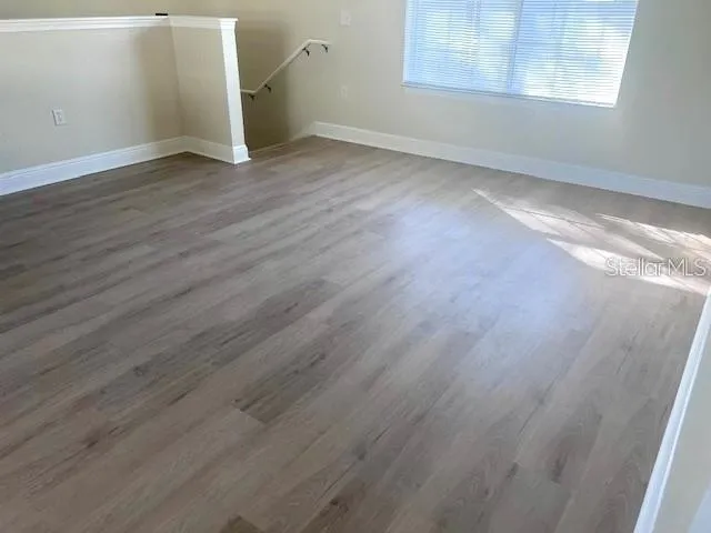 a kitchen with a sink cabinets and window