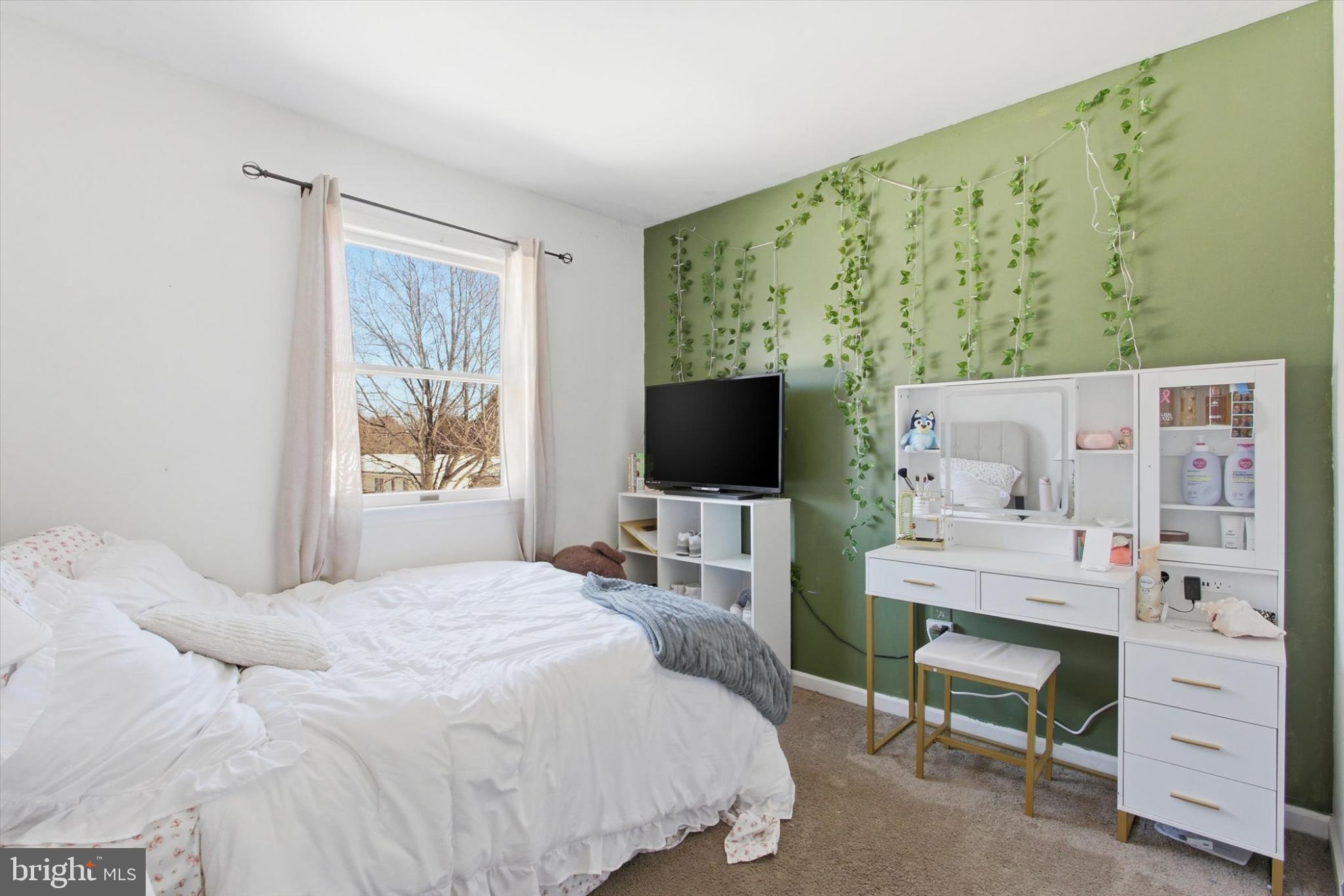 794 Barrett Street Hanover, PA 17331 - Photo 12 of 22 a bedroom with a bed and a flat screen tv