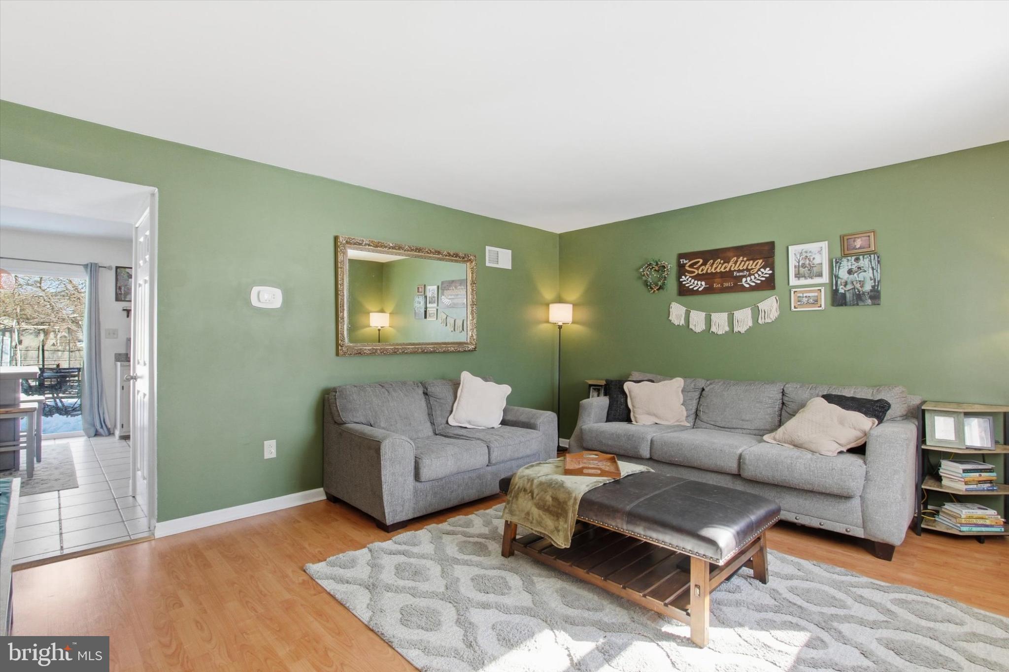 794 Barrett Street Hanover, PA 17331 - Photo 5 of 22 a living room with furniture and a wooden floor