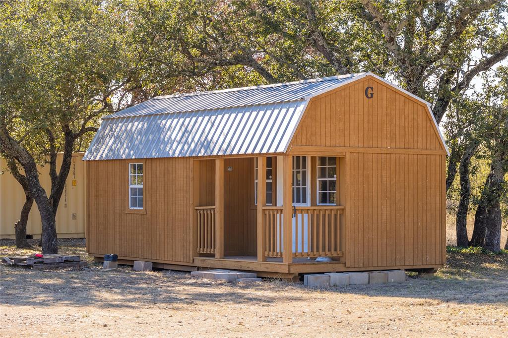 451 County Road 423 May, TX 76857 - Photo 26 of 40 a view of a house with a wooden fence