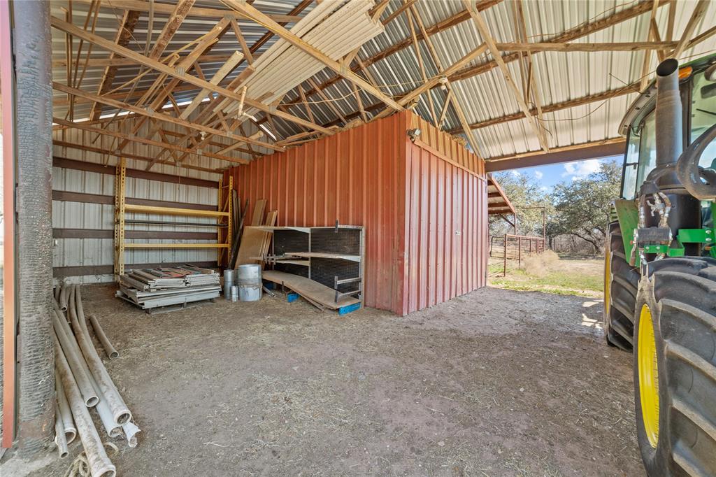 451 County Road 423 May, TX 76857 - Photo 34 of 40 a view of a room with wooden walls and stairs