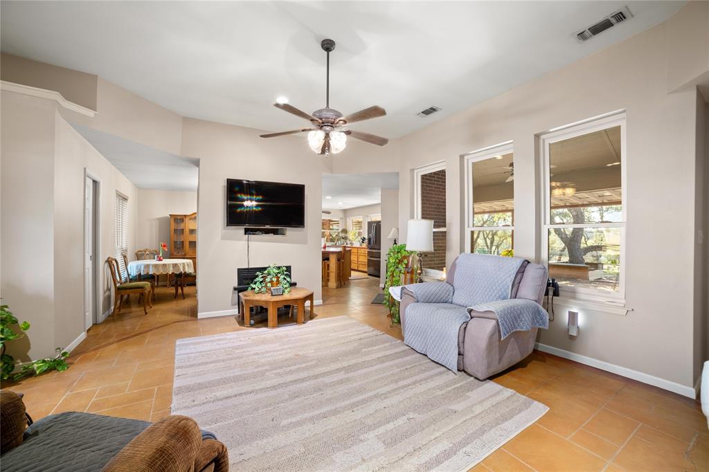 451 County Road 423 May, TX 76857 - Photo 6 of 40 a living room with furniture fireplace and a flat screen tv