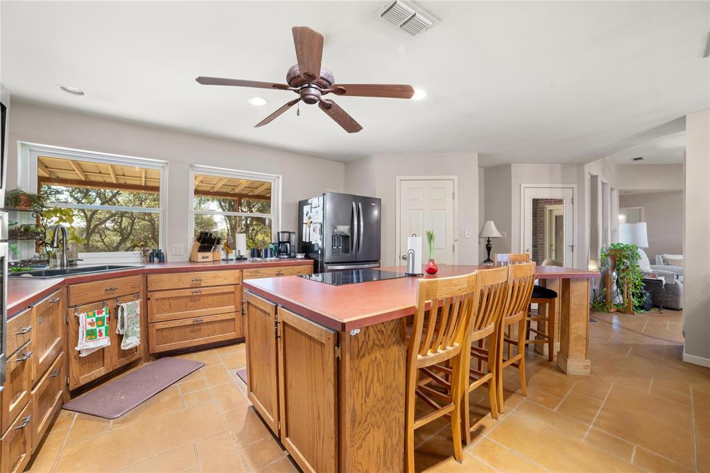 451 County Road 423 May, TX 76857 - Photo 10 of 40 a large kitchen with a table and chairs