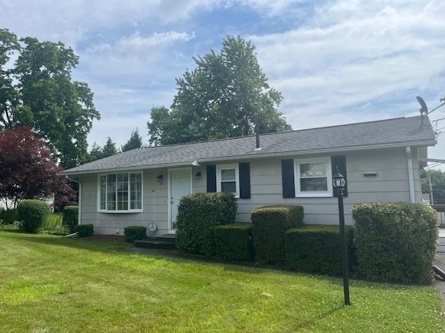 a view of a house with backyard tub and garden