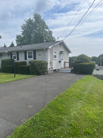 72 Elmore Street Holyoke, MA 01040 - Photo 28 of 28 a house view with a garden space