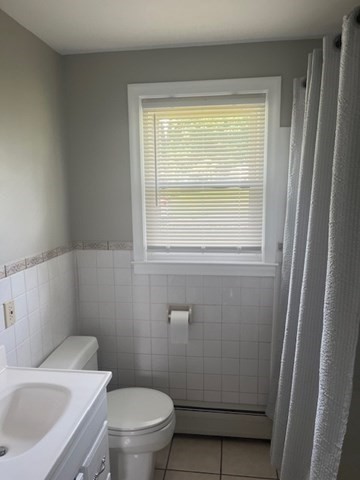 72 Elmore Street Holyoke, MA 01040 - Photo 9 of 28 a bathroom with a sink and a toilet