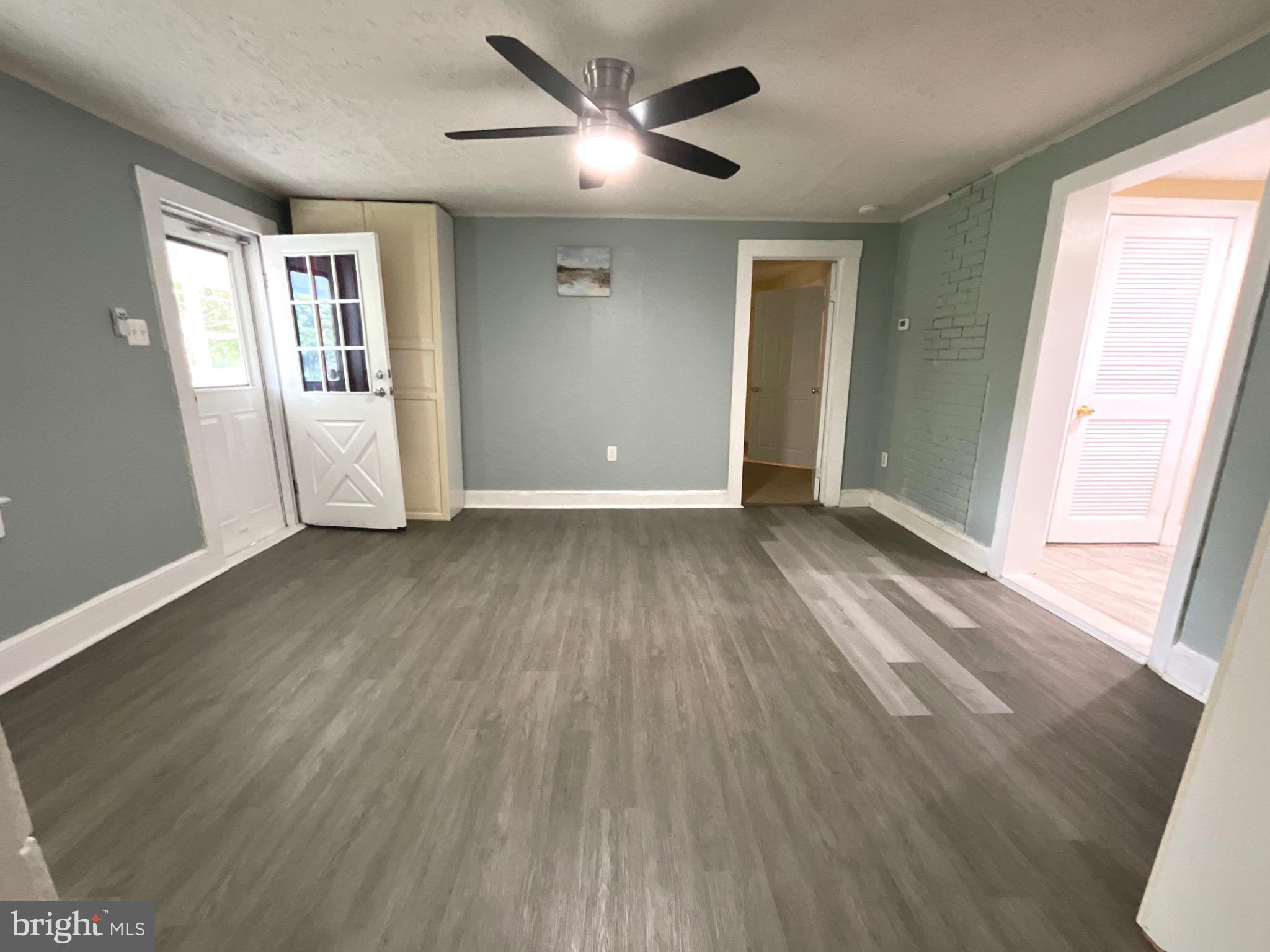 86 Kelley Road Fredericksburg, VA 22405 - Photo 5 of 36 an empty room with wooden floor and windows