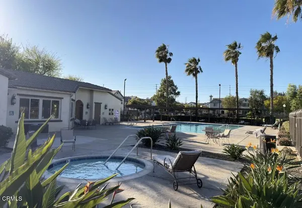 a view of a backyard with sitting area