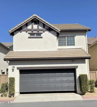 a front view of a house with a garage