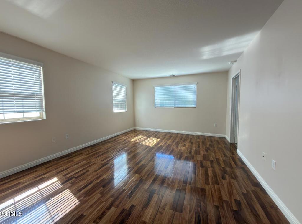 433 Merced Court Corona, CA 92878 - Photo 8 of 22 a view of empty room with wooden floor