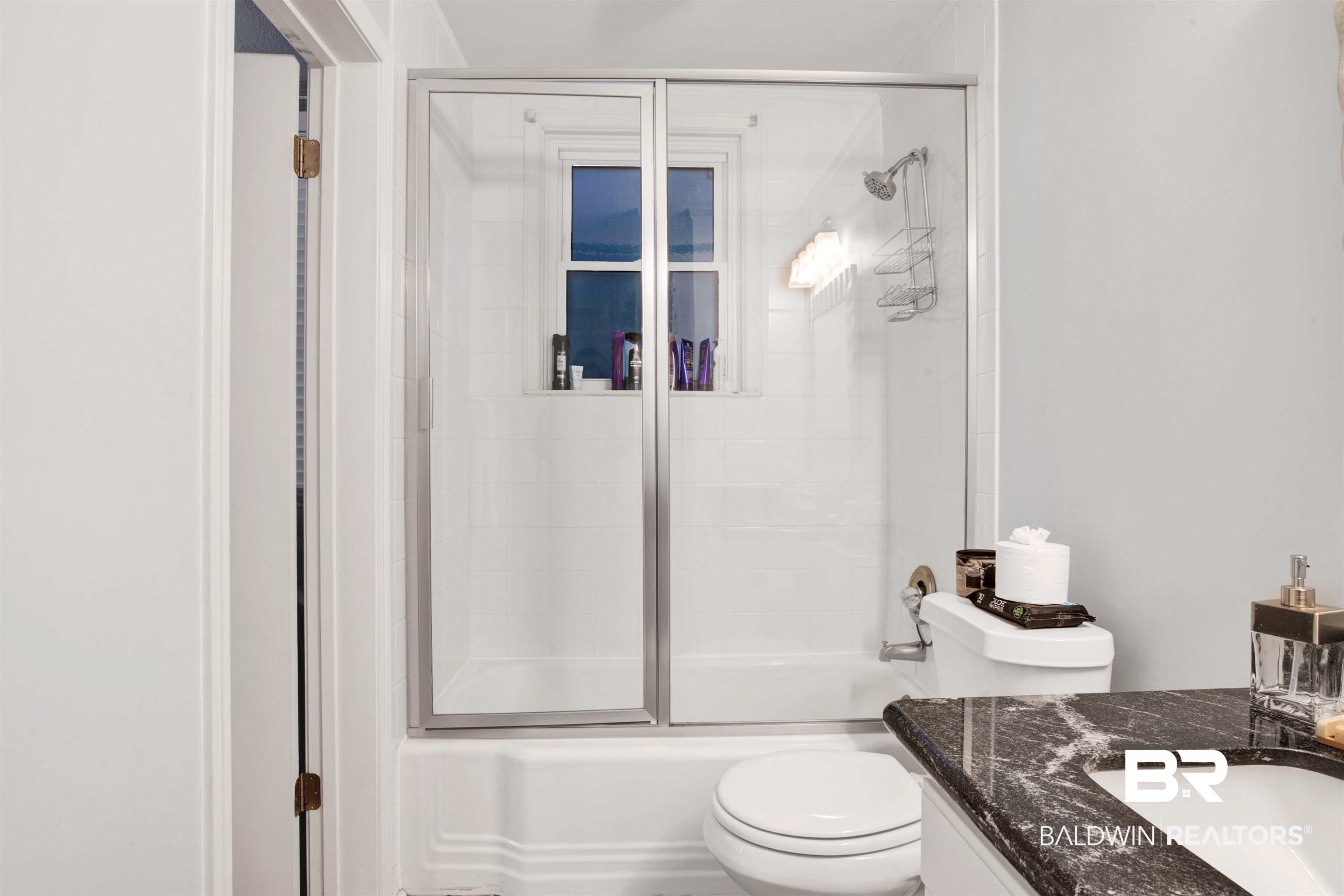 605 Van Avenue Daphne, AL 36526 - Photo 18 of 37 Full bathroom featuring vanity, enclosed tub / shower combo, and toilet