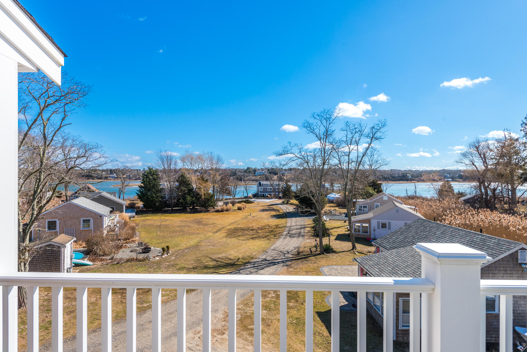 704 State Highway Eastham, MA 02642 - Photo 21 of 26 a view of a balcony with dining table and chairs