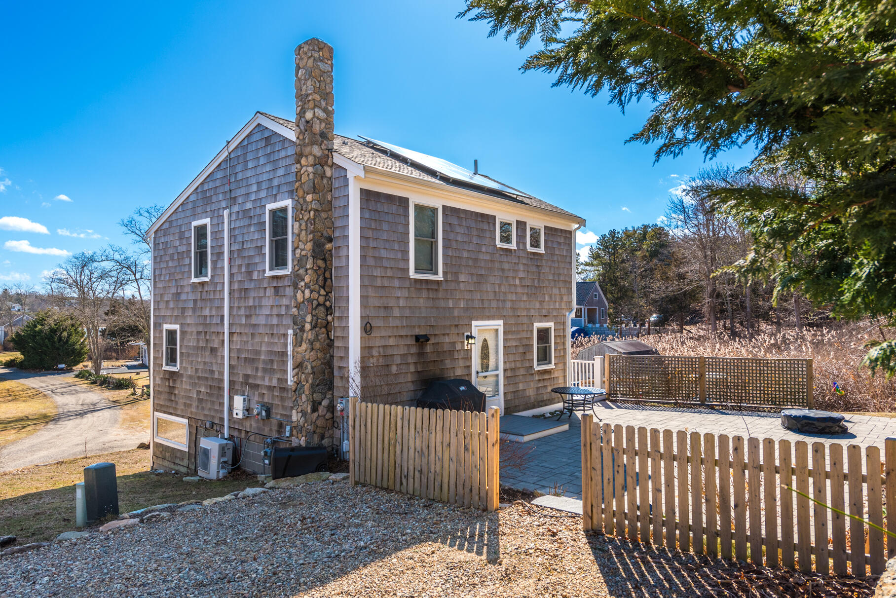 704 State Highway Eastham, MA 02642 - Photo 22 of 26 a front view of a house with a yard
