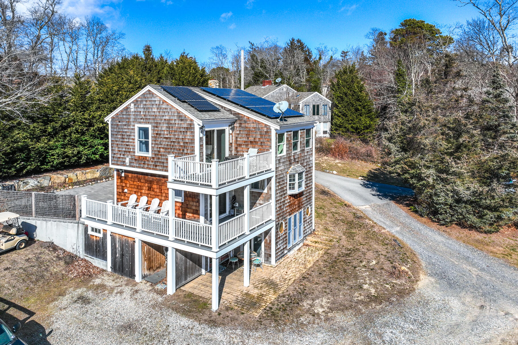 704 State Highway Eastham, MA 02642 - Photo 23 of 26 a front view of a house with a yard and mountain view