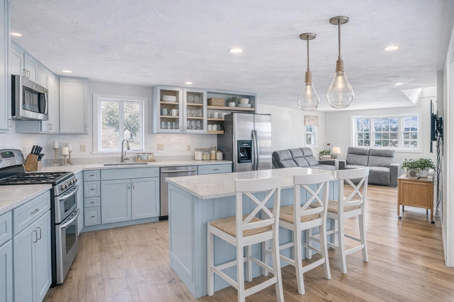704 State Highway Eastham, MA 02642 - Photo 4 of 26 a kitchen with a dining table chairs sink and cabinets