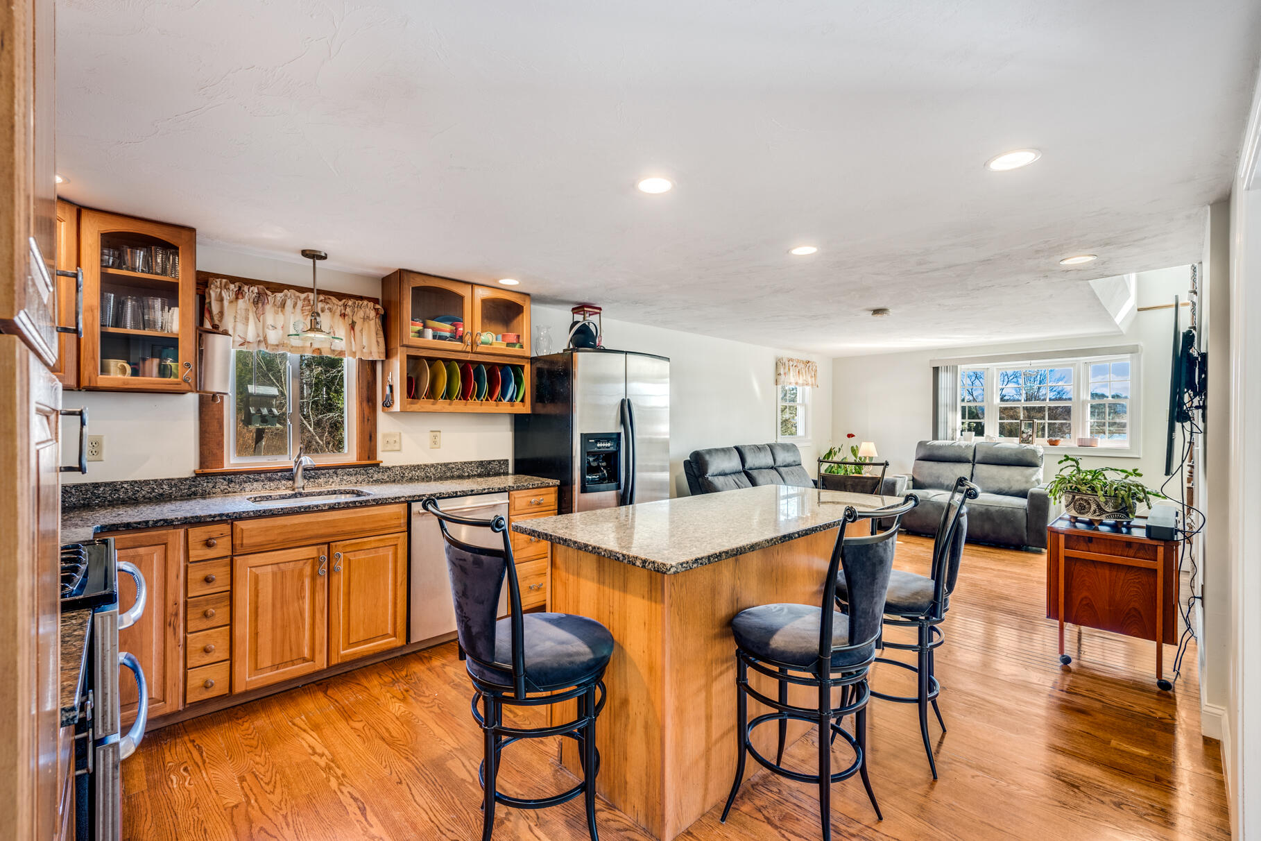 704 State Highway Eastham, MA 02642 - Photo 5 of 26 a dining table with chairs and wooden floor
