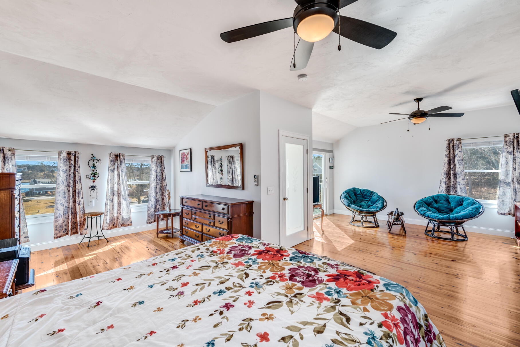 704 State Highway Eastham, MA 02642 - Photo 9 of 26 a bedroom with furniture and a wooden floor