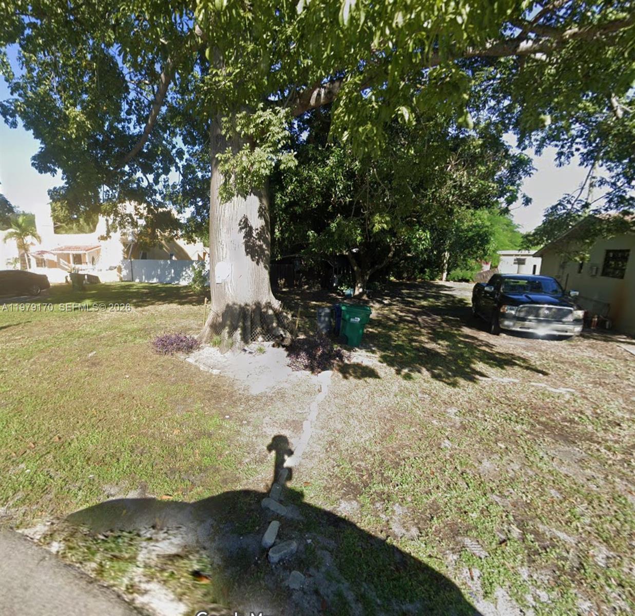 613 Sharar Avenue Opa-Locka, FL 33054 - Photo 1 of 1 a view of a yard with wooden fence